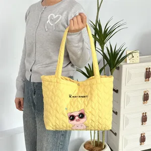 Yellow quilted heart tote bag with cute cartoon pig embroidery for women daily shopping.