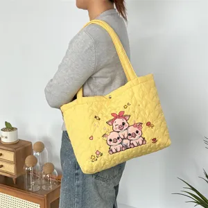Yellow quilted tote bag with cute cartoon pig embroidery, casual shoulder handbag for women.