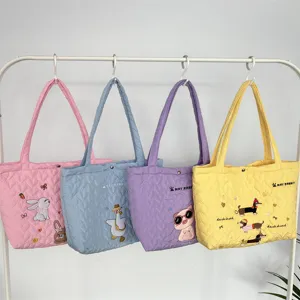 Cute quilted tote bag with cartoon embroidery, soft large capacity shoulder bag for daily use.