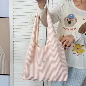 Detail view of the casual pink and white striped canvas shoulder tote bag, ideal for daily use.
