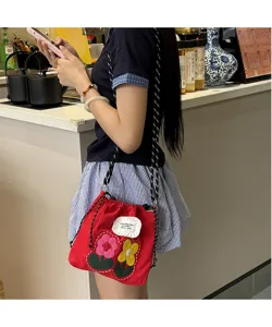 Cute red canvas crossbody phone bag with sweet embroidered floral design and thick strap.
