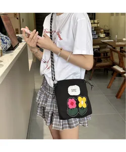 Black canvas cross body phone bag with cute embroidered colorful flowers, trendy casual daily use.
