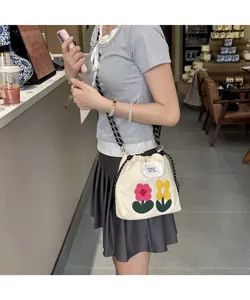 Canvas floral shoulder bag, cute embroidered flower bucket bag for women daily casual commute.