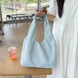 Detailed view of casual striped tote bag, lightweight crinkle fabric, perfect for summer daily use.