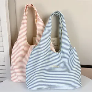 Minimalist striped shoulder bag, lightweight casual hobo tote bag for women daily use.