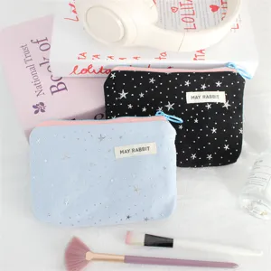 Silver star sequin coin purse detail view, portable makeup zipper pouch for daily use.