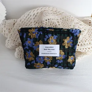 Borsa cosmetica floreale con goffratura vintage, trousse portatile per viaggi e trucco.