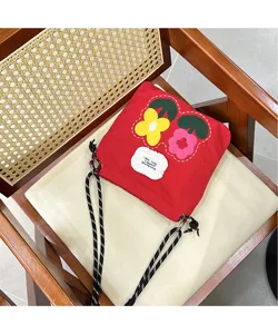 Embroidered floral canvas phone bag, casual red crossbody bag for women daily commute.