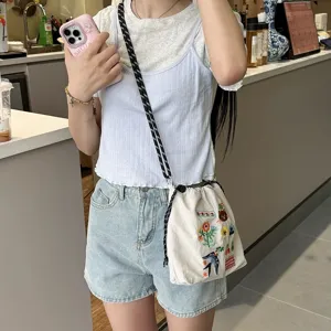 Canvas mobile phone bag with cute floral embroidery, casual crossbody bag for women daily commute.