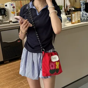 Canvas crossbody phone bag with cute embroidered flowers, casual small pouch for women daily use.