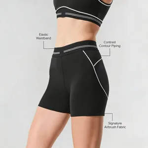 Black athletic yoga set for women, contrast piping sports bra and biker shorts activewear.