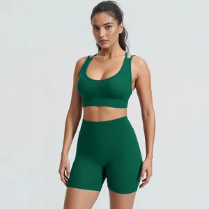 Detailed view of the dark green ribbed sports bra and high-waisted fitness shorts set.