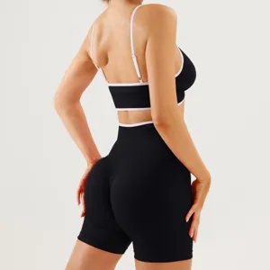 Women black sports bra and shorts activewear set, back view detail showing athletic fit.