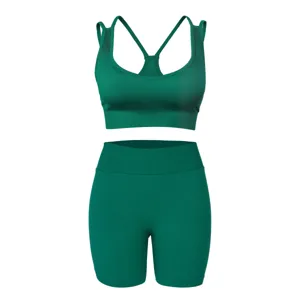 Green ribbed yoga set detail, sports bra and shorts, high elasticity fitness activewear.