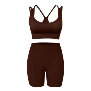 Close-up of the ribbed fabric and cross-back straps of the brown workout yoga set.