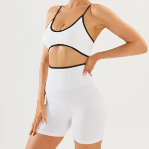 Close-up detail of the contrast trim sports bra and high-waist fitness shorts set.