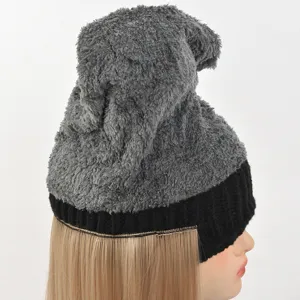 Detailed side view of the grey plush beanie hat featuring long straight blonde hair.