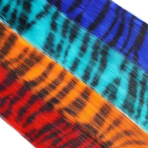 Synthetic clip-in colored hair extensions vibrant tiger stripe strands close-up detail