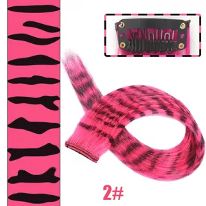 Clip-in synthetic hair extensions pink leopard print highlight hair piece detail view