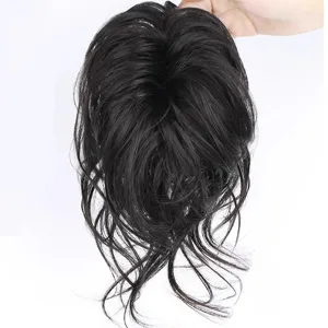 Detail shot of black synthetic claw clip hair bun showing fluffy messy ponytail texture.