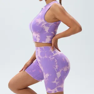 Purple tie-dye women activewear set, ribbed zip crop top and biker shorts for fitness yoga.