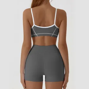 Women activewear backless yoga set athletic fitness sports bra and high waist shorts detail.