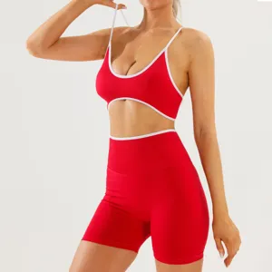 Detail shot of a red contrast trim activewear set with sports bra and shorts.