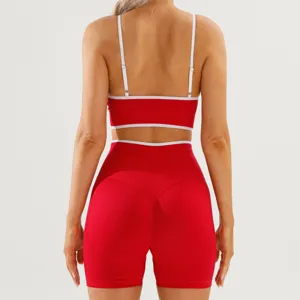 Back view detail of women color-block athletic workout set with backless sports bra and tight shorts.