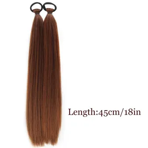 Synthetic straight hair ponytail extension detail, brown low pigtails with black rubber bands.