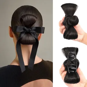 Close-up detail showing the black hair bun claw clip with bow, highlighting back wear and design.