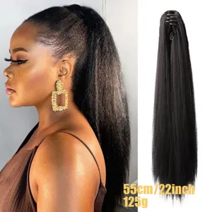 Claw clip straight ponytail extension detail, long black synthetic hair piece closeup view.