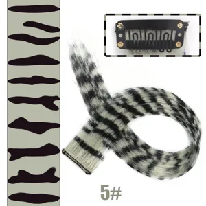 Leopard print clip-in hair extension detail view showing color pattern and secure metal clip.