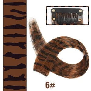 Synthetic clip-in hair extension with tiger print and color 6#, showing clip detail.