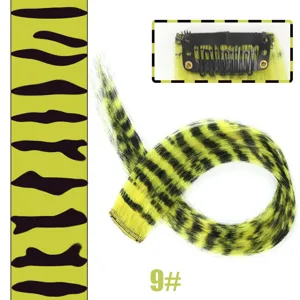 Clip-in synthetic hair extension with bold leopard print pattern, vibrant color highlight.