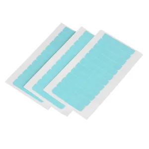 Detail view of blue double-sided lace wig tape sheets with white backing paper for hair.
