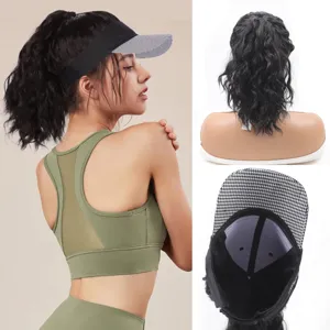 Detail view of women hat hair curly synthetic wig baseball cap with visor and ponytail extension.
