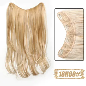 Detail view of blonde V-shaped hair extension piece with clips and natural layered design.