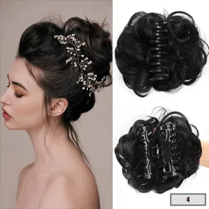 Close-up of messy synthetic hair bun claw clip with natural texture and durable plastic base.