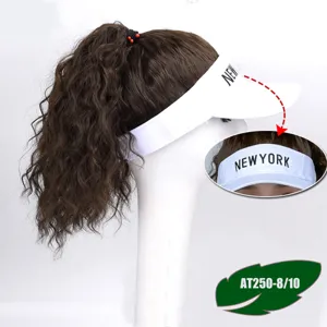 Detail view of the brown curly hair extension attached to a white baseball cap, stylish.