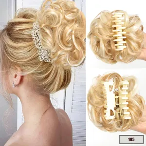 Detailed view of blonde messy bun hair extension with sturdy claw clip, showing fluffy texture.