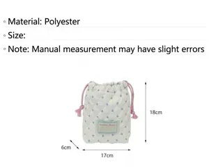 Quilted polka dot drawstring bag, polyester portable storage pouch for small items, cute design.