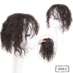 Short kinky curly hair topper hair extension detail view showing inner clips and wave texture.