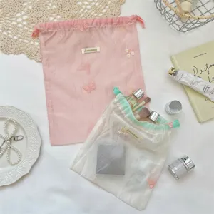 Transparante organza trekkoord opbergtassen met lief bloemborduursel voor cosmetica sieraden.