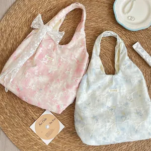 Floral embroidered canvas shoulder bag with cute lace bow, soft tie-dye aesthetic tote.