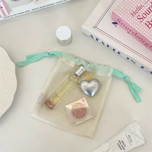 Mintgruener Netztaschen-Aufbewahrungsbeutel mit Schleife, suesses Kosmetitaeschchen fuer unterwegs.