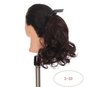 Synthetic wavy curly hair ponytail extension with black ribbon, 25cm brown wig piece.