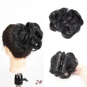 Close-up details of the fluffy claw clip synthetic hair bun, showing hair texture and clasp.