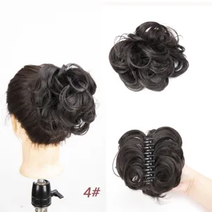 Detailed view of fluffy synthetic hair bun with claw clip, natural wavy design for quick styling.