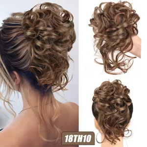 Synthetic messy hair bun extension detail shot, fluffy curly updo hairpiece with wispy ends.