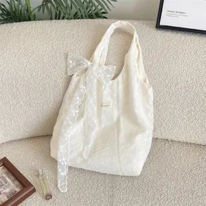 Floral embroidered hollow tote bag detail, Korean style canvas handbag with sweet lace bow.